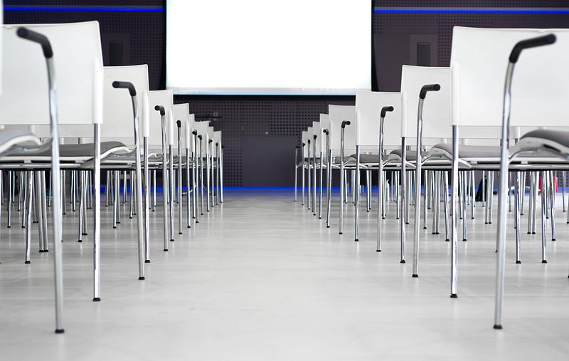a conference hall aisle with chairs
